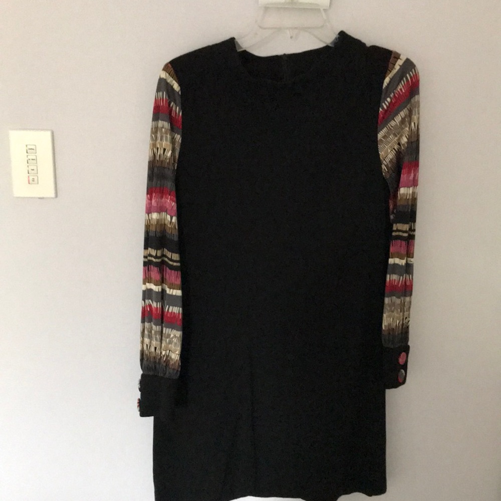 Black A line dress with multi colored sleeves.